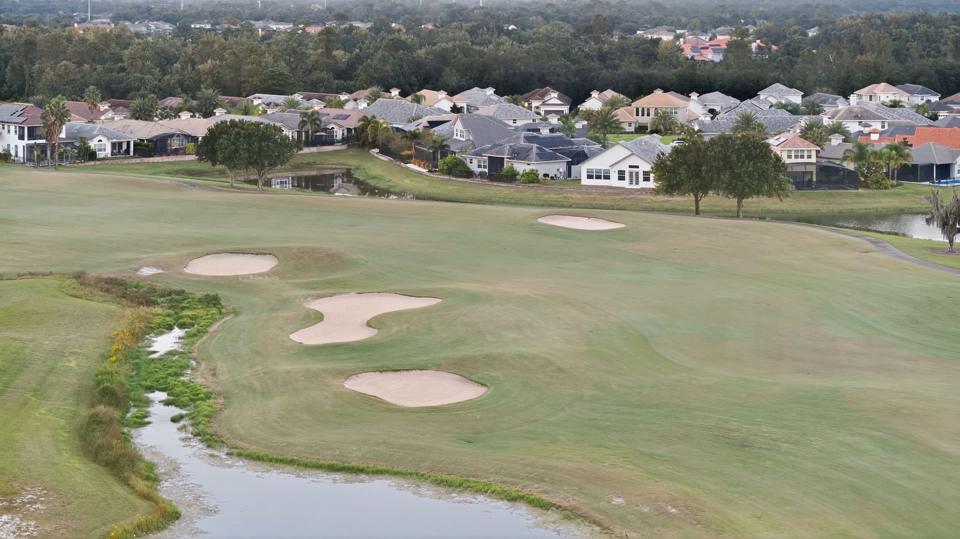 Sand bunkers and a green on the Providence golf course