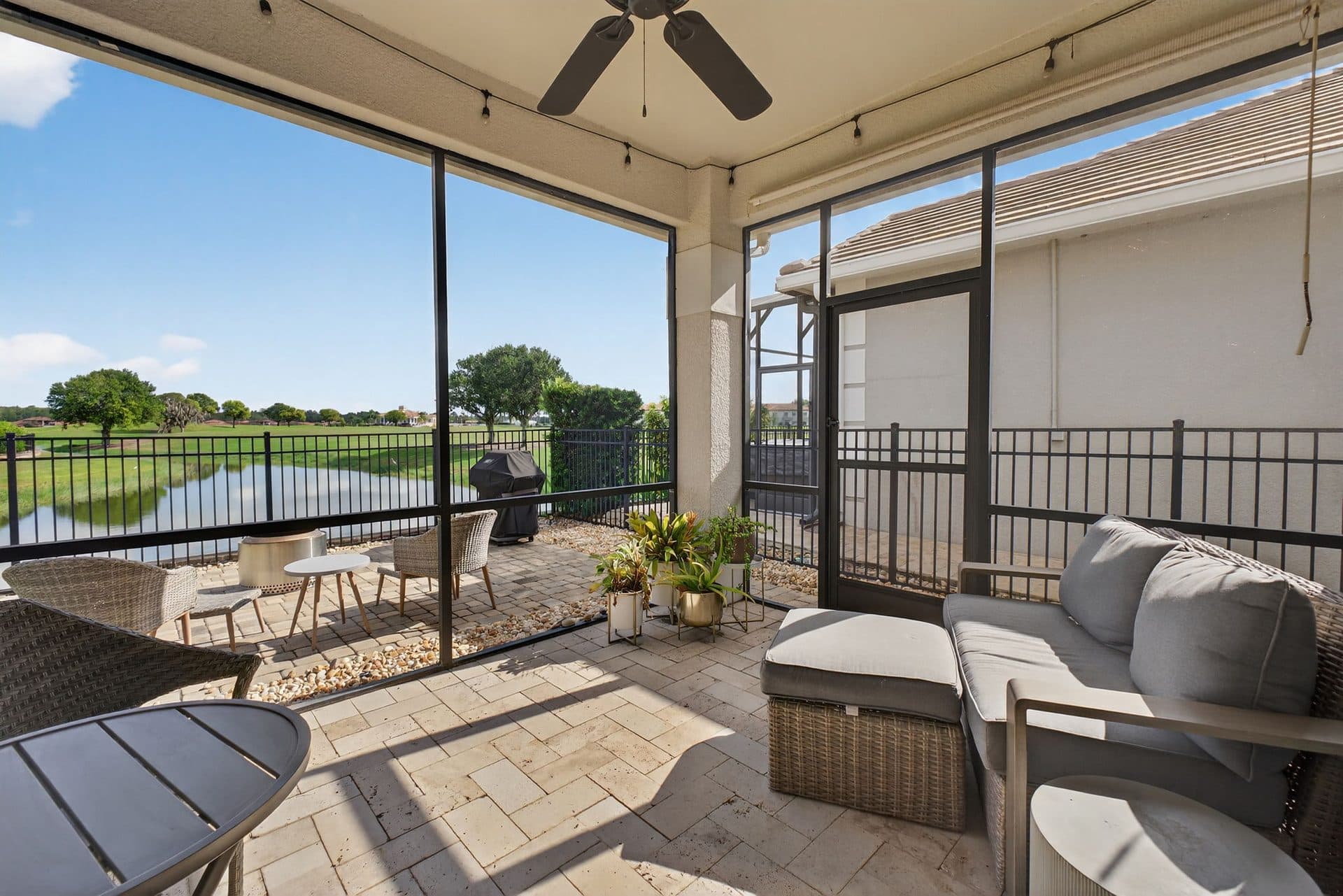 Screened lanai at 2021 Sherbrook Ave looking out to the pond and golf course