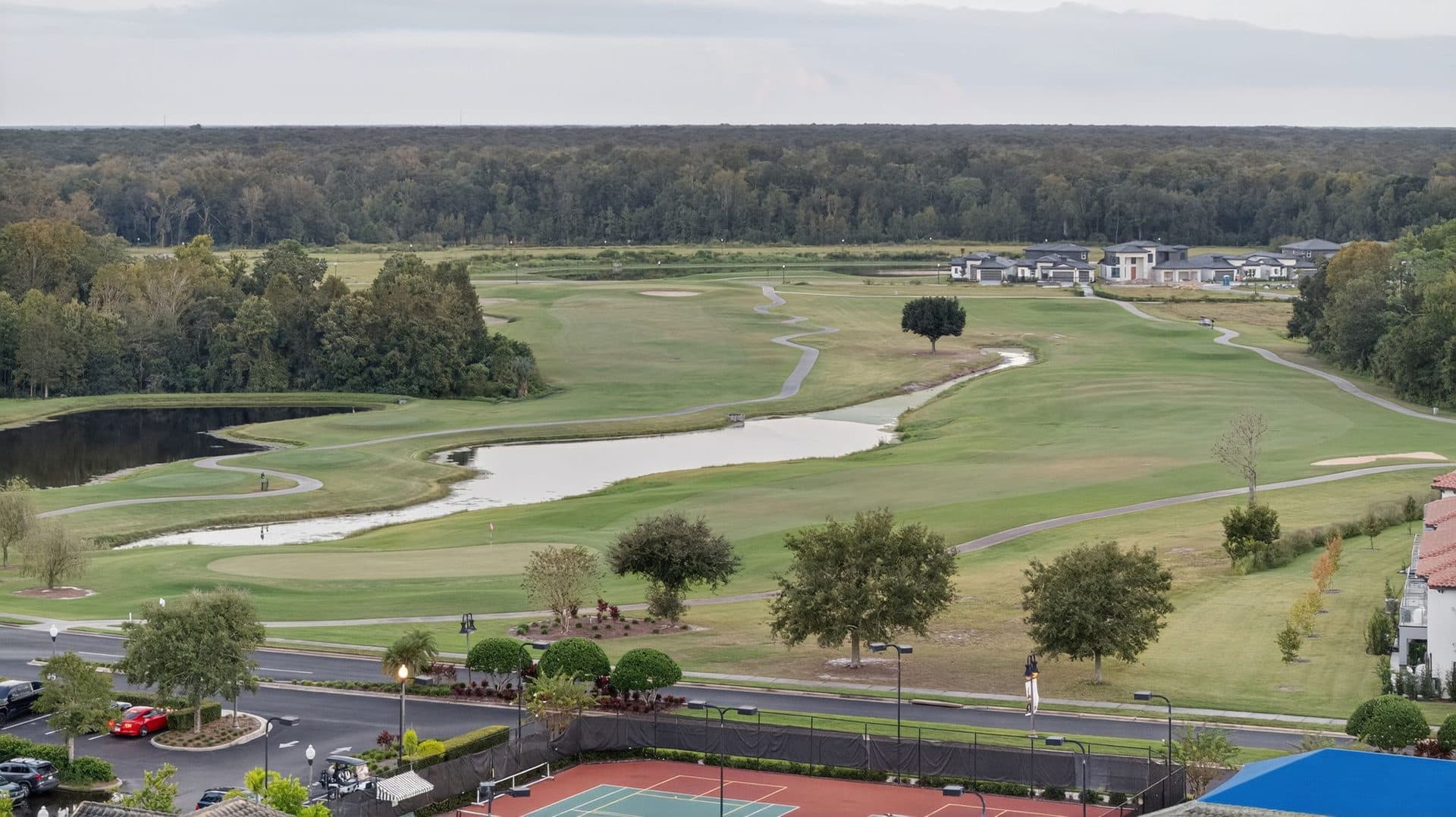 A fairway on the Providence golf course lined with oaks